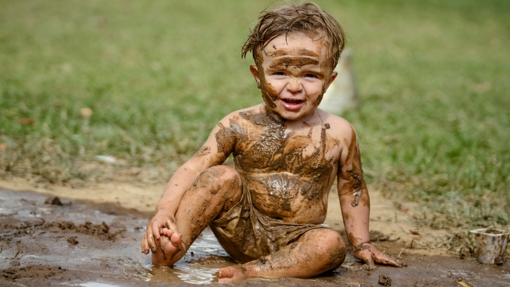 The Hidden Benefits of Letting Kids Play in Dirt and Mud